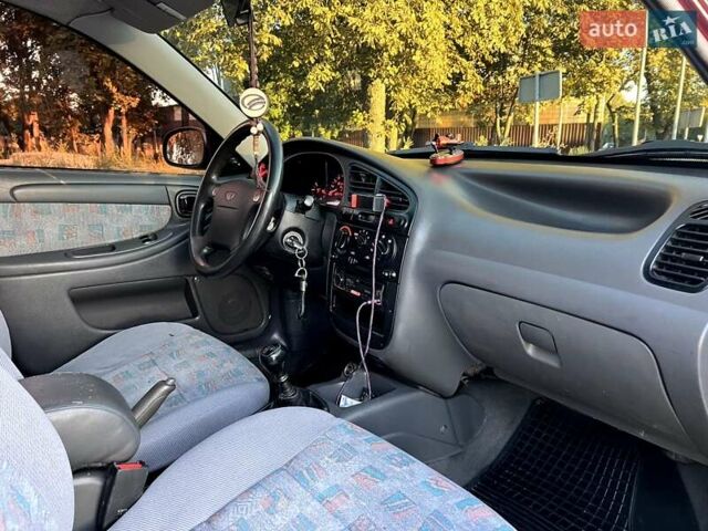 Красный Дэу Ланос, объемом двигателя 1.5 л и пробегом 150 тыс. км за 3300 $, фото 4 на Automoto.ua