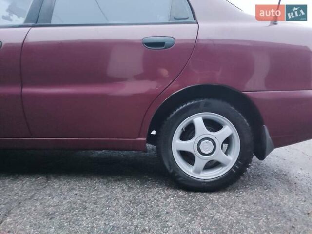 Красный Дэу Ланос, объемом двигателя 1.6 л и пробегом 244 тыс. км за 2850 $, фото 1 на Automoto.ua