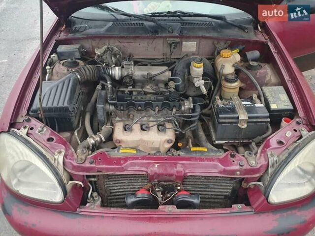 Красный Дэу Ланос, объемом двигателя 1.5 л и пробегом 226 тыс. км за 2400 $, фото 10 на Automoto.ua