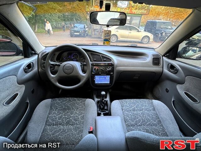 Красный Дэу Ланос, объемом двигателя 1.5 л и пробегом 290 тыс. км за 1950 $, фото 4 на Automoto.ua