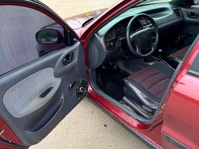 Красный Дэу Ланос, объемом двигателя 1.5 л и пробегом 310 тыс. км за 1950 $, фото 6 на Automoto.ua