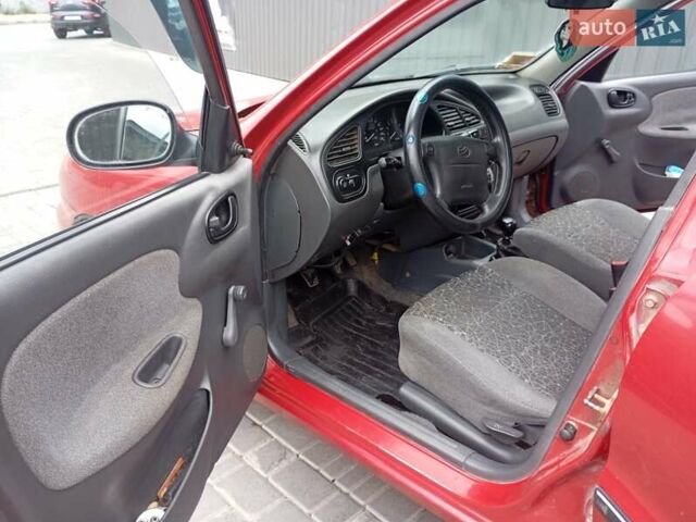 Красный Дэу Ланос, объемом двигателя 1.5 л и пробегом 207 тыс. км за 2800 $, фото 12 на Automoto.ua