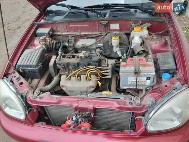Красный Дэу Ланос, объемом двигателя 1.5 л и пробегом 191 тыс. км за 2500 $, фото 5 на Automoto.ua