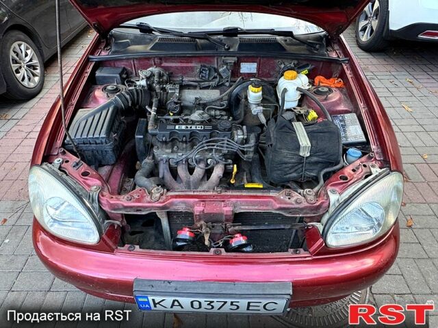 Красный Дэу Ланос, объемом двигателя 1.5 л и пробегом 290 тыс. км за 1950 $, фото 10 на Automoto.ua