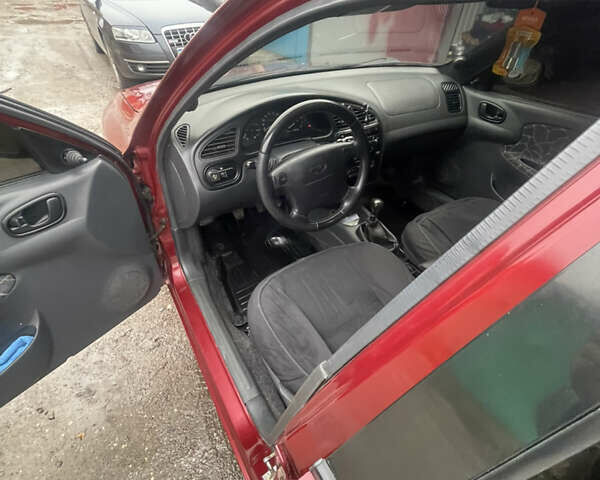 Красный Дэу Ланос, объемом двигателя 1.5 л и пробегом 399 тыс. км за 2499 $, фото 15 на Automoto.ua