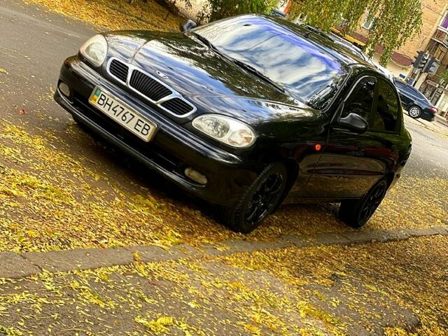 Красный Дэу Ланос, объемом двигателя 1.5 л и пробегом 116 тыс. км за 3500 $, фото 7 на Automoto.ua