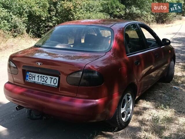 Красный Дэу Ланос, объемом двигателя 1.6 л и пробегом 304 тыс. км за 2900 $, фото 4 на Automoto.ua