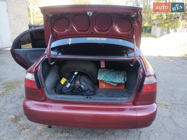 Красный Дэу Ланос, объемом двигателя 1.5 л и пробегом 322 тыс. км за 2200 $, фото 6 на Automoto.ua