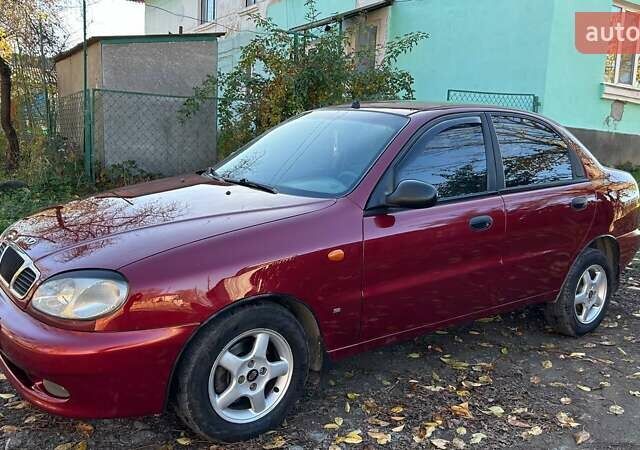 Красный Дэу Ланос, объемом двигателя 1.6 л и пробегом 216 тыс. км за 1900 $, фото 3 на Automoto.ua