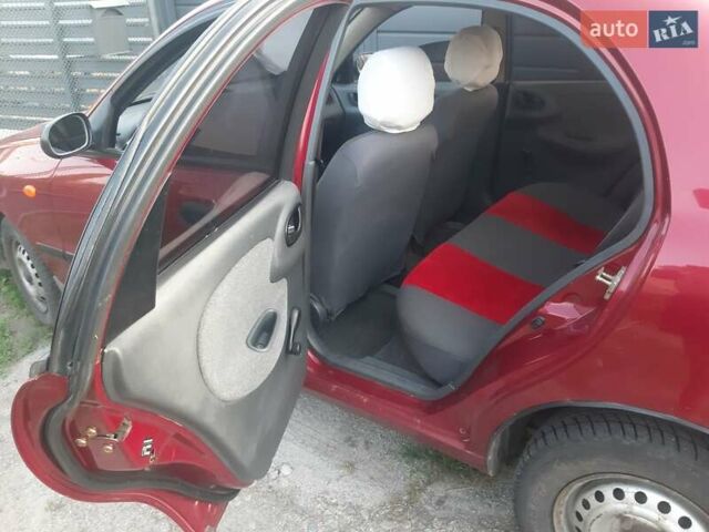 Червоний Деу Ланос, об'ємом двигуна 1.5 л та пробігом 211 тис. км за 2099 $, фото 1 на Automoto.ua