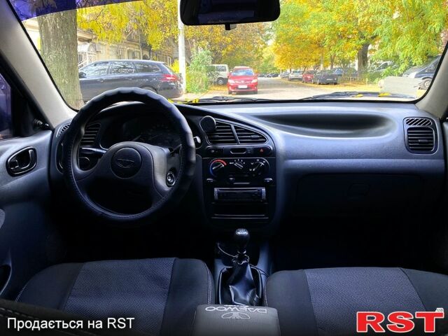Красный Дэу Ланос, объемом двигателя 1.5 л и пробегом 116 тыс. км за 3500 $, фото 10 на Automoto.ua