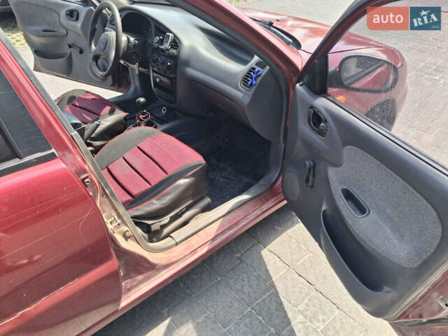Красный Дэу Ланос, объемом двигателя 1.5 л и пробегом 250 тыс. км за 1150 $, фото 8 на Automoto.ua