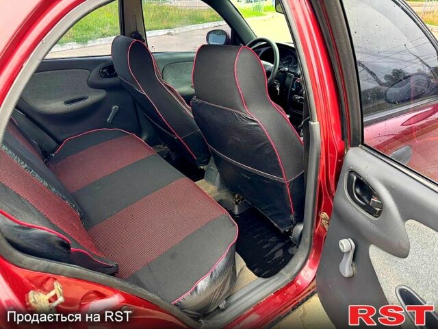 Красный Дэу Ланос, объемом двигателя 1.5 л и пробегом 310 тыс. км за 1950 $, фото 7 на Automoto.ua
