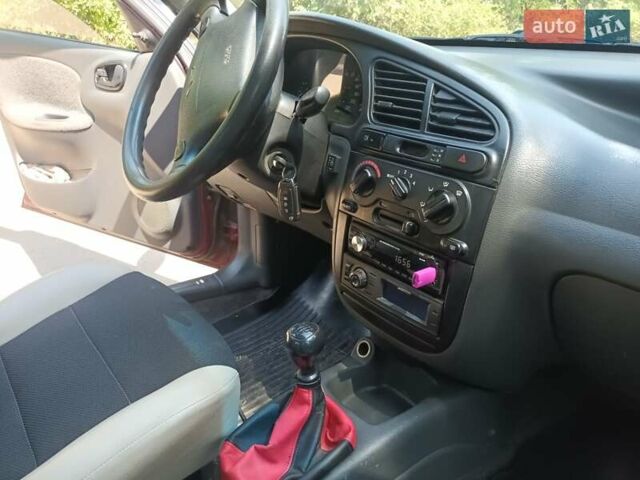 Красный Дэу Ланос, объемом двигателя 1.6 л и пробегом 304 тыс. км за 2900 $, фото 9 на Automoto.ua