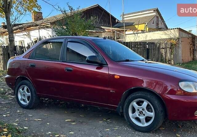 Красный Дэу Ланос, объемом двигателя 1.6 л и пробегом 216 тыс. км за 1900 $, фото 10 на Automoto.ua