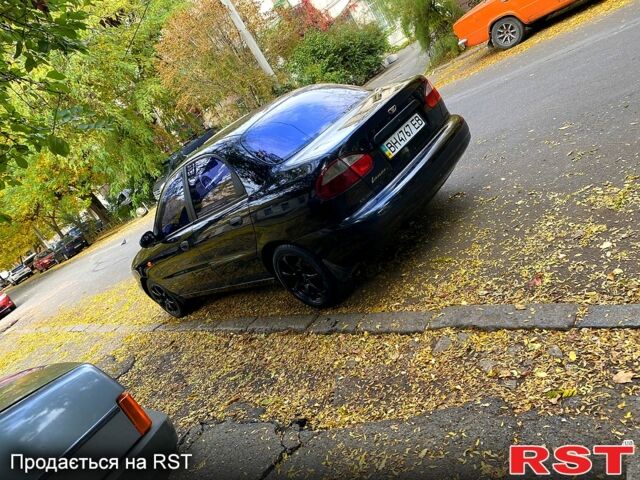 Красный Дэу Ланос, объемом двигателя 1.5 л и пробегом 116 тыс. км за 3500 $, фото 6 на Automoto.ua