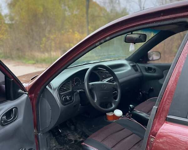 Красный Дэу Ланос, объемом двигателя 1.5 л и пробегом 210 тыс. км за 1700 $, фото 6 на Automoto.ua