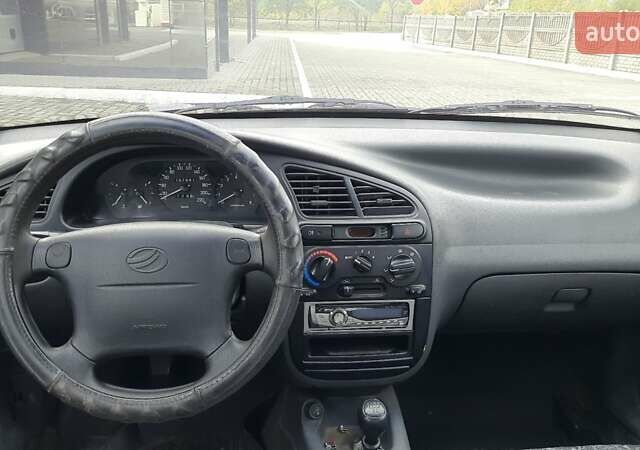 Красный Дэу Ланос, объемом двигателя 1.5 л и пробегом 151 тыс. км за 1299 $, фото 13 на Automoto.ua
