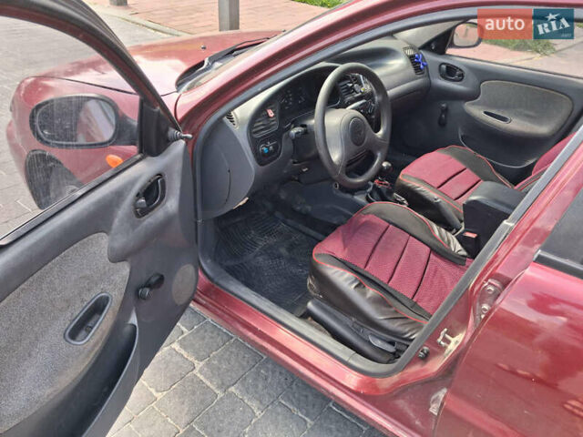 Красный Дэу Ланос, объемом двигателя 1.5 л и пробегом 250 тыс. км за 1150 $, фото 7 на Automoto.ua