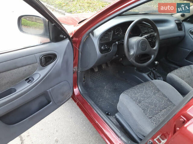 Красный Дэу Ланос, объемом двигателя 1.5 л и пробегом 270 тыс. км за 2450 $, фото 7 на Automoto.ua