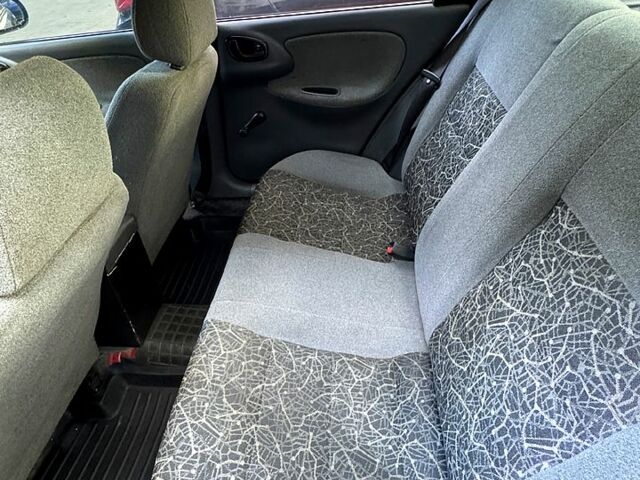 Красный Дэу Ланос, объемом двигателя 1.5 л и пробегом 290 тыс. км за 1950 $, фото 5 на Automoto.ua