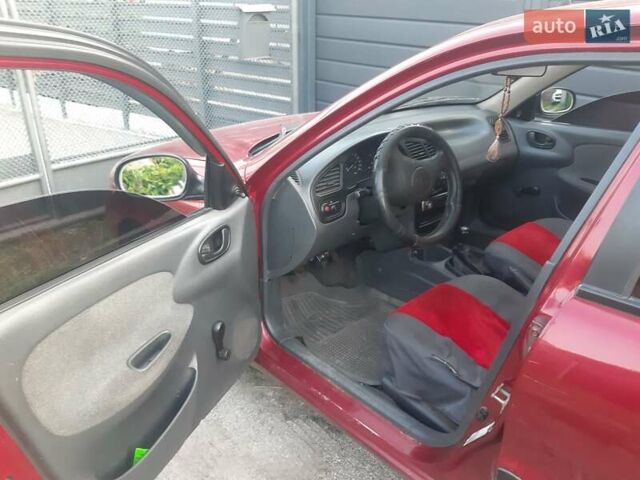 Червоний Деу Ланос, об'ємом двигуна 1.5 л та пробігом 211 тис. км за 2099 $, фото 4 на Automoto.ua