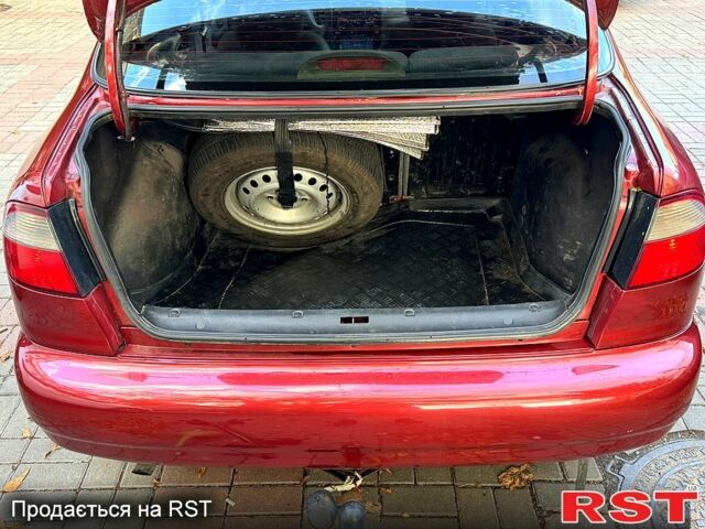 Красный Дэу Ланос, объемом двигателя 1.5 л и пробегом 290 тыс. км за 1950 $, фото 12 на Automoto.ua