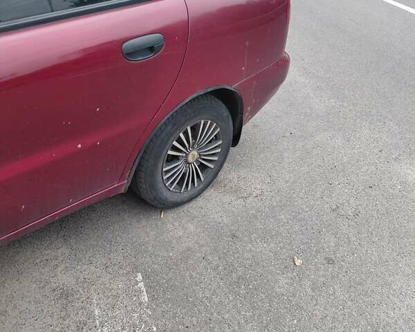 Красный Дэу Ланос, объемом двигателя 1.5 л и пробегом 309 тыс. км за 2200 $, фото 7 на Automoto.ua