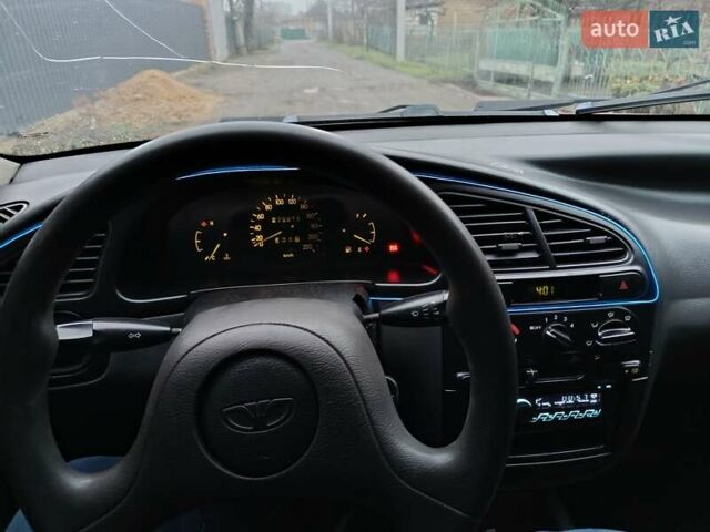 Красный Дэу Ланос, объемом двигателя 1.3 л и пробегом 270 тыс. км за 1500 $, фото 3 на Automoto.ua