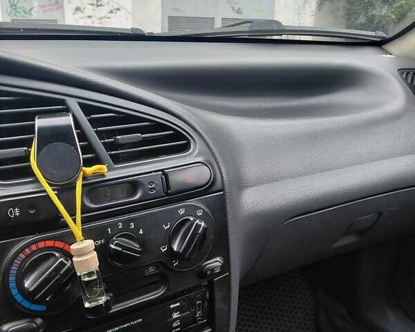 Красный Дэу Ланос, объемом двигателя 1.5 л и пробегом 309 тыс. км за 2000 $, фото 10 на Automoto.ua