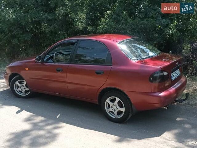 Красный Дэу Ланос, объемом двигателя 1.6 л и пробегом 304 тыс. км за 2900 $, фото 1 на Automoto.ua