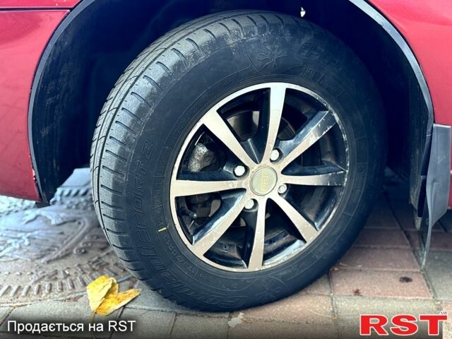 Красный Дэу Ланос, объемом двигателя 1.5 л и пробегом 290 тыс. км за 1950 $, фото 8 на Automoto.ua