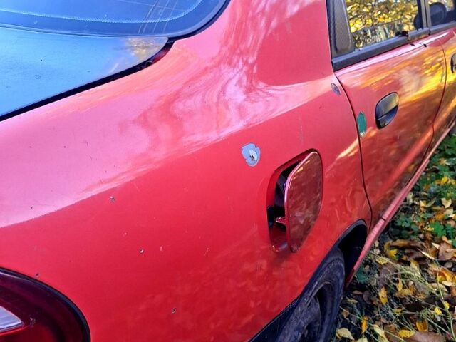 Деу Ланос 2006 у Смеле на Automoto.ua Червоний Деу Ланос, об'ємом двигуна 1.5 л та пробігом 316 тис. км за 1000 $, фото 9 на Automoto.ua