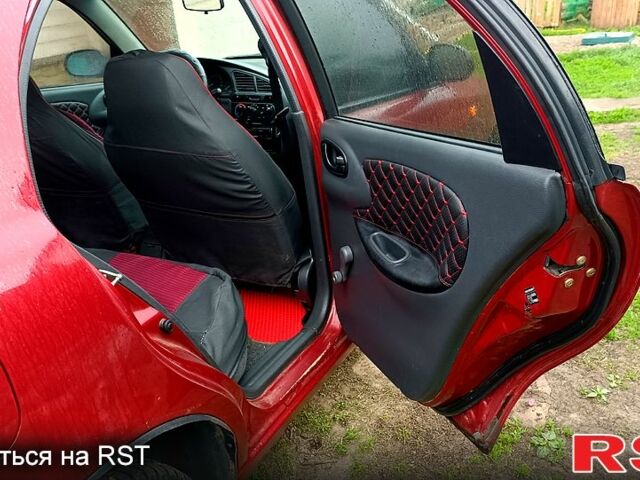 Красный Дэу Ланос, объемом двигателя 1.5 л и пробегом 163 тыс. км за 2200 $, фото 7 на Automoto.ua