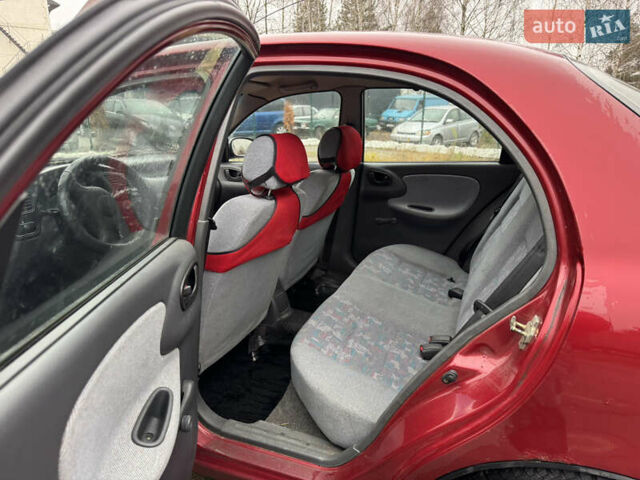 Красный Дэу Ланос, объемом двигателя 1.5 л и пробегом 310 тыс. км за 1850 $, фото 7 на Automoto.ua