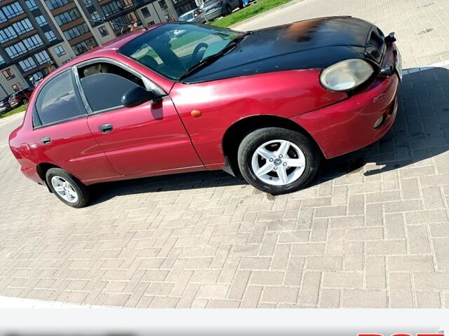 Красный Дэу Ланос, объемом двигателя 1.5 л и пробегом 150 тыс. км за 1300 $, фото 2 на Automoto.ua