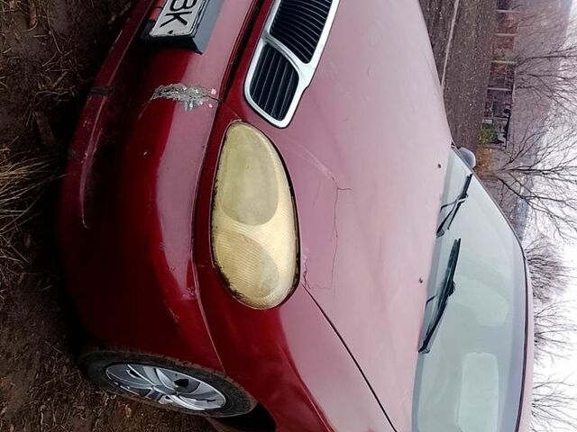 Красный Дэу Ланос, объемом двигателя 1.5 л и пробегом 150 тыс. км за 690 $, фото 2 на Automoto.ua