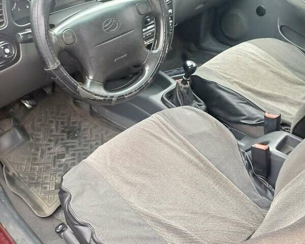 Красный Дэу Ланос, объемом двигателя 1.5 л и пробегом 501 тыс. км за 2400 $, фото 9 на Automoto.ua