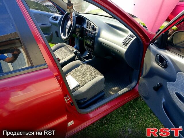Красный Дэу Ланос, объемом двигателя 1.5 л и пробегом 204 тыс. км за 2200 $, фото 6 на Automoto.ua