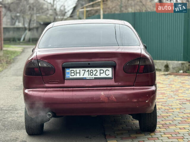 Красный Дэу Ланос, объемом двигателя 1.5 л и пробегом 270 тыс. км за 1400 $, фото 4 на Automoto.ua