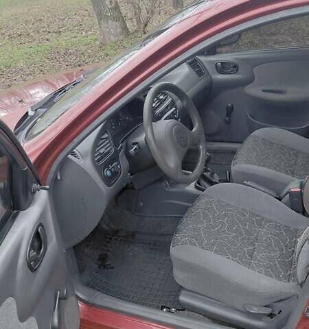 Красный Дэу Ланос, объемом двигателя 1.5 л и пробегом 230 тыс. км за 2600 $, фото 11 на Automoto.ua