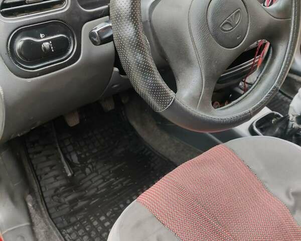 Красный Дэу Ланос, объемом двигателя 1.5 л и пробегом 275 тыс. км за 1700 $, фото 5 на Automoto.ua