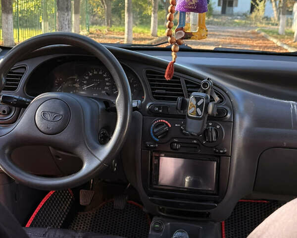 Красный Дэу Ланос, объемом двигателя 1.5 л и пробегом 195 тыс. км за 2200 $, фото 14 на Automoto.ua