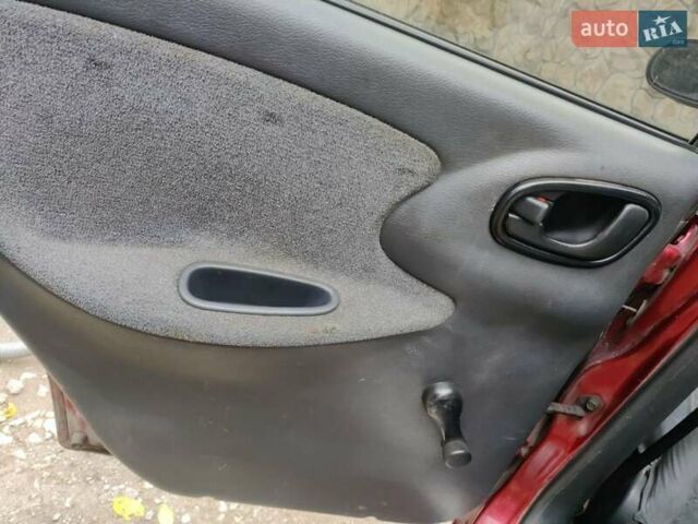 Красный Дэу Ланос, объемом двигателя 1.5 л и пробегом 275 тыс. км за 1700 $, фото 13 на Automoto.ua