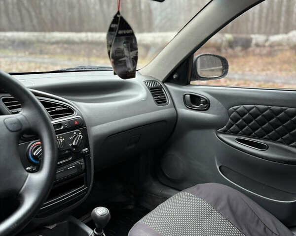 Красный Дэу Ланос, объемом двигателя 1.6 л и пробегом 235 тыс. км за 2150 $, фото 13 на Automoto.ua