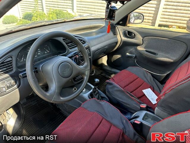 Красный Дэу Ланос, объемом двигателя 1.5 л и пробегом 190 тыс. км за 1399 $, фото 6 на Automoto.ua