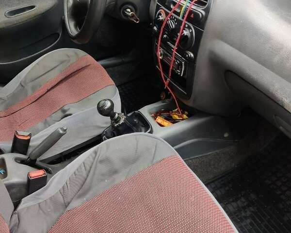 Красный Дэу Ланос, объемом двигателя 1.5 л и пробегом 275 тыс. км за 1700 $, фото 7 на Automoto.ua