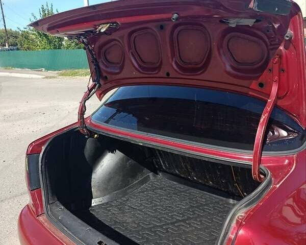 Красный Дэу Ланос, объемом двигателя 1.5 л и пробегом 330 тыс. км за 2550 $, фото 1 на Automoto.ua