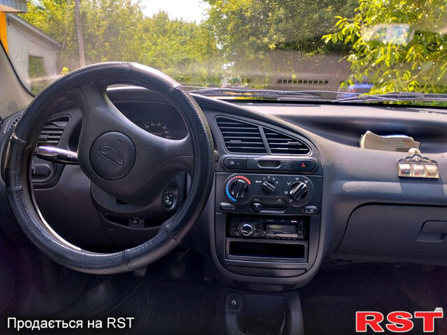 Красный Дэу Ланос, объемом двигателя 1.5 л и пробегом 132 тыс. км за 2390 $, фото 6 на Automoto.ua