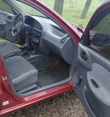 Красный Дэу Ланос, объемом двигателя 1.5 л и пробегом 230 тыс. км за 2600 $, фото 15 на Automoto.ua